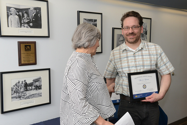 Danuta Nitecki, Dean of Libraries, presents Spencer Lamm with an award during the 2017 Libraries Celebration Awards ceremony